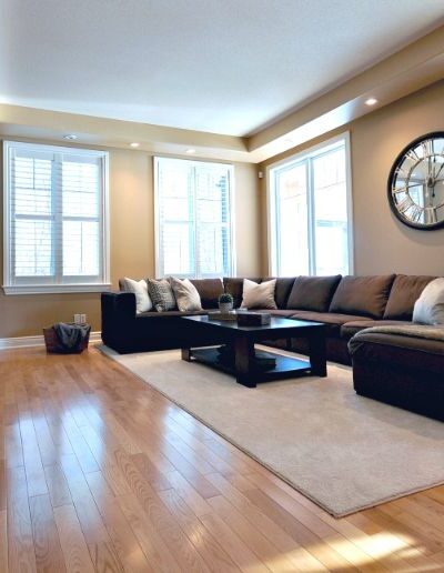 Staged living room in brown and tan by Cindy Lutes, Total Home
