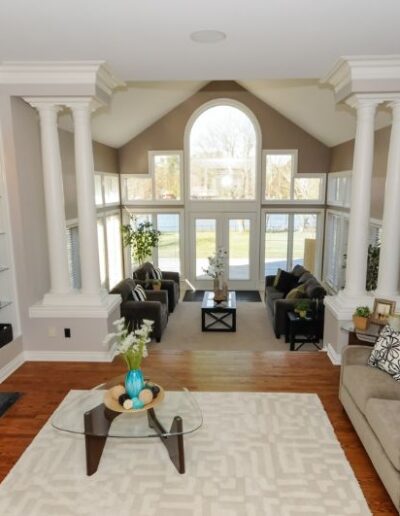 Staged living room in white and tan by Cindy Lutes, Total Home