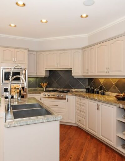 Staged Kitchen in cream and white by Cindy Lutes, Total Home