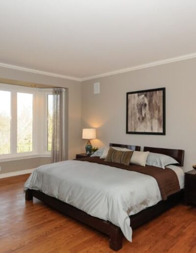 Staged bedroom in brown and tan by Cindy Lutes, Total Home