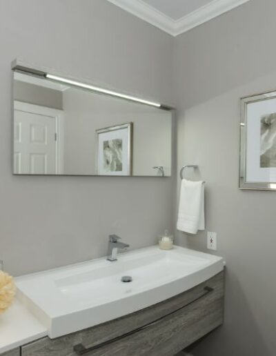 Staged bathroom in grey and silver by Cindy Lutes, Total Home