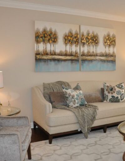 Staged living room in cream and blue by Cindy Lutes, Total Home