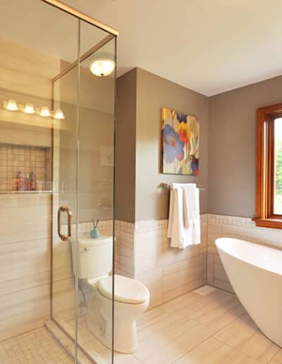 Glass walk-in shower and freestanding bathtub in basement bathroom renovation Kemptville