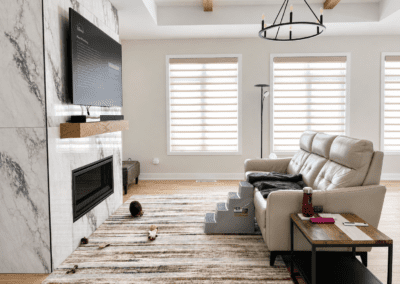 Living room before redesign featuring existing furniture and unfinished styling in Hallville Ontario home.