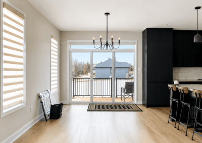 Bright open-concept living and kitchen area in a newly built Hallville home before furnishing and styling.
